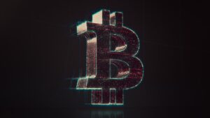 A shiny bitcoin logo on a black background