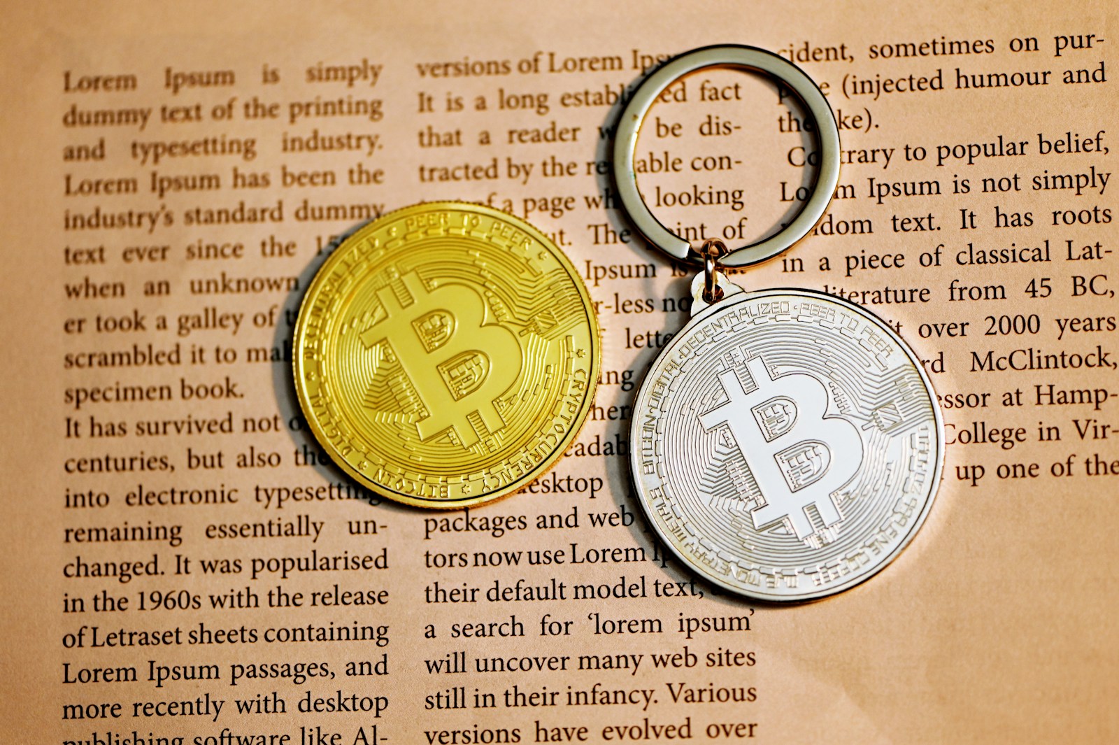 silver round coin on white printer paper